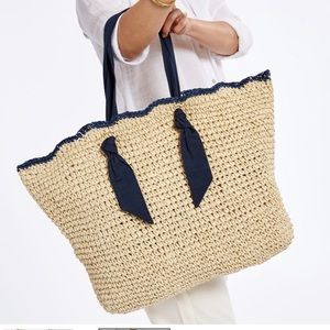 Straw tote beach bag with scalloped edge and cloth ribbon handles